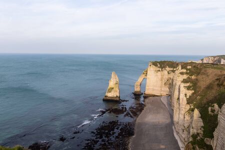 Etretat, Normandy, France - The seafront and the 'Aval' cliff, with the natural arch and the needleの写真素材