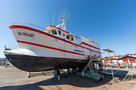 JUL 19, 2020 - Hendaye, Basque Country, France - Old fishing boat dry-docked in Hendaye Harborのeditorial素材