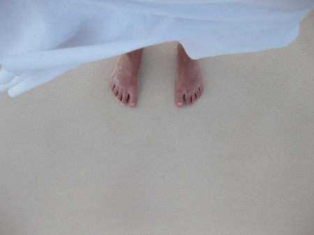 A photo of two feet in the water