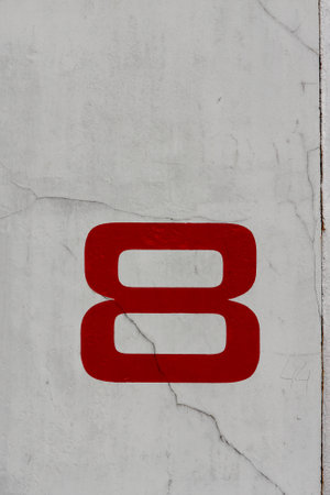 A photo of a number eight on a wall
