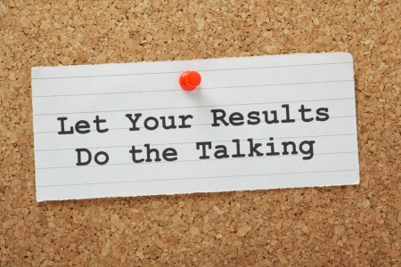 The phrase Let Your Results Do The Talking on a cork notice board の写真素材