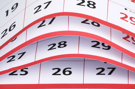 A close up view of the open pages of a calendar with the date numbers visibleの写真素材