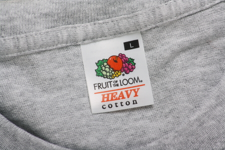 Bracknell, England - March 19, 2014  A close up of the Fruit of the Loom clothing label on a grey...