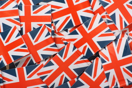Miniature flags of the United Kingdom arranged to form a backgroundの写真素材