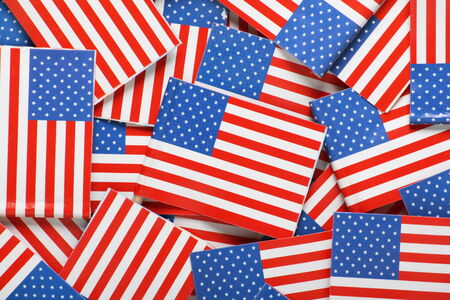 Miniature flags of the United States of America arranged to form a backgroundの写真素材