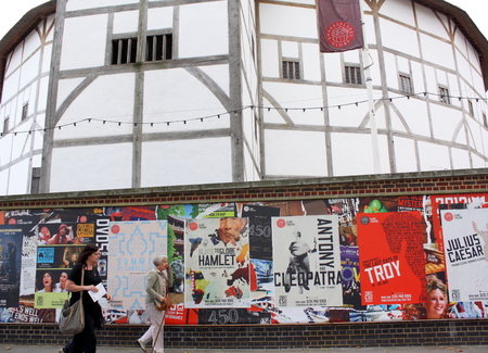  London - Aug 17  People passing posters advertising plays at The Globe Theater on 21st August 2014  The theater, a reconstruction of Shakespeare s original globe, opened for performances in 1997のeditorial素材
