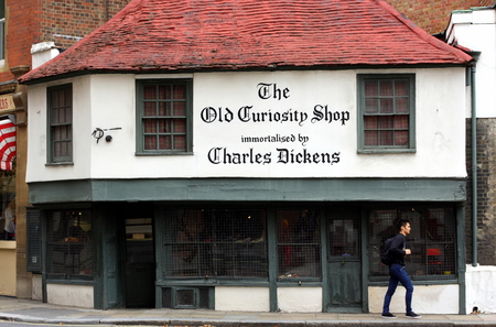 London, England - Sept 11, 2014: A pedestrian passes by The Old Curiosity Shop in London, a 16th...