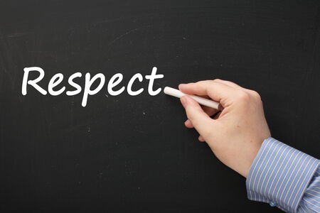Hand writing the word Respect on a blackboardの写真素材