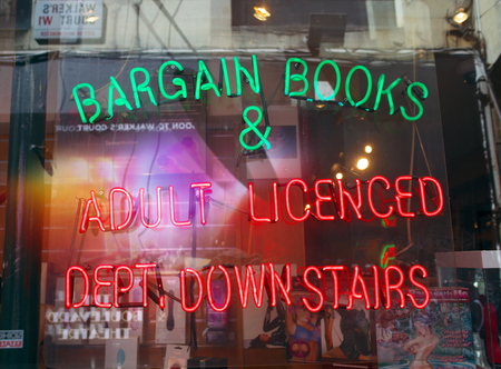 London, England - April 30, 2015: Porn shop window display with neon sign in the Soho district of London, England. Soho is in London\'s West End and is a popular tourist destination.のeditorial素材