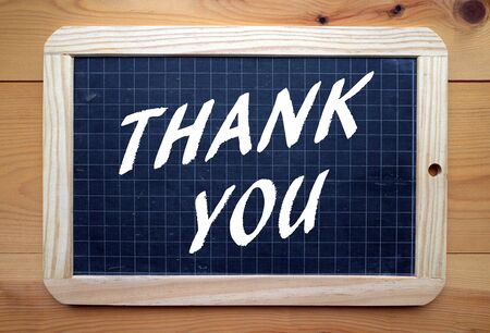 The phrase Thank You in white text on a blackboardの写真素材