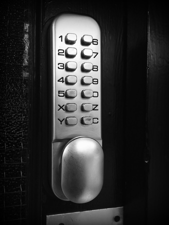 Black and white image of a generic door entry security code panel with numbered keys.の写真素材
