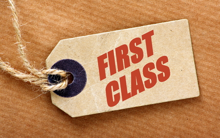 Luggage Tag with the words First Class added in red textの写真素材