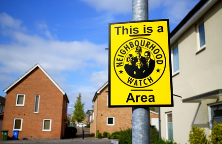 Bracknell, England - April 12, 2017: Sign warning This is a Neighbourhood Watch Area on a housing state in Bracknell, England. The association aims to bring communities together and reduce crimeのeditorial素材