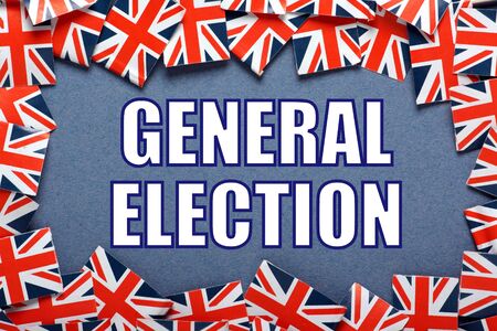 The words General Election in white text surrounded by union jack flags of the United Kingdomの写真素材
