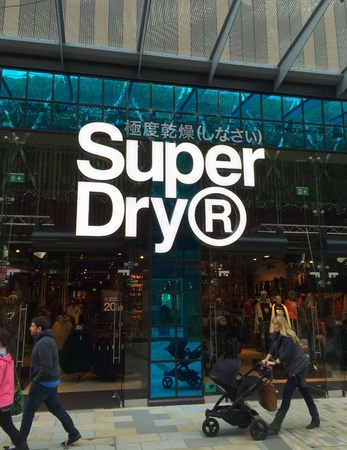 Bracknell, England - Nov 21, 2017: People passing by the Superdry clothing store in Bracknell,...