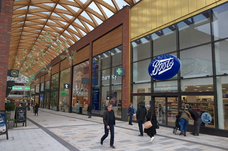 Bracknell, England - Nov 22, 2017: People passing by the Boots store in the Lexicon shopping center, opened in 2017 as part of the ongoing redevelopment of Bracknell Town in Englandのeditorial素材