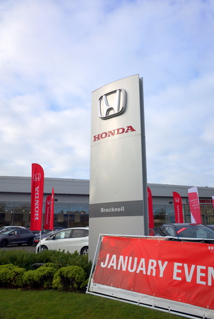 Bracknell,England - January 22, 2018: Signs and vehicles in front of the Honda Car Dealership in Bracknell, England. The Honda Motor Company was incorporated in Japan in 1948のeditorial素材