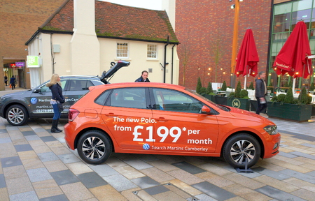 Bracknell, England - January 31, 2018: The new Volkswagen Polo car, accompanied by representatives of a Volkswagen dealership is displayed in the town center of Bracknell, Englandのeditorial素材