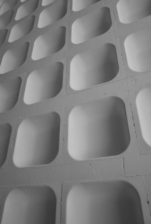 The molded concrete ceiling of a car park photographed to provided an abstract background and processed in black and white for effectの写真素材