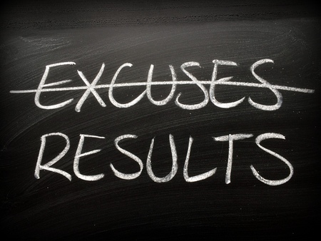 The word Excuses crossed out on a backboard and replaced with the word Resultsの写真素材
