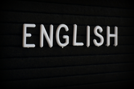 The word English in white plastic letters on a notice boardの写真素材