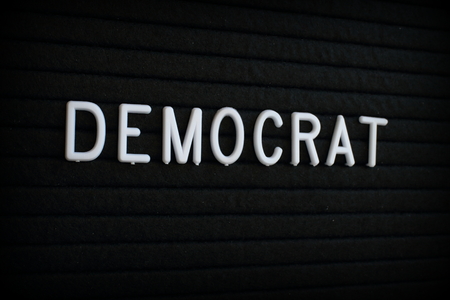 The word Democrat in white plastic letters on a black letter boardの写真素材