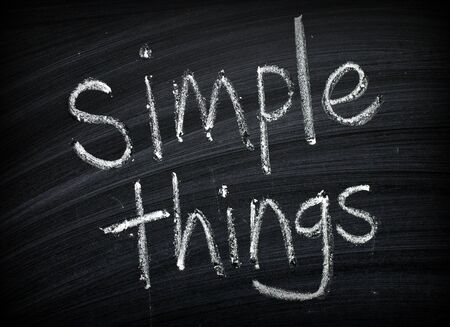 The phrase Simple Things written by hand on a blackboard as a reminder