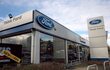 Bracknell, England - February 23, 2020: Exterior of a showroom for new and used Ford motor cars in Bracknell, Englandのeditorial素材