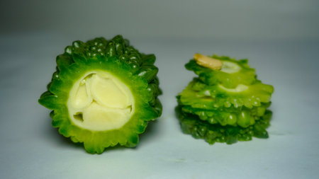 Fresh bitter melon on white. Healthy bitter melon for human body.の写真素材