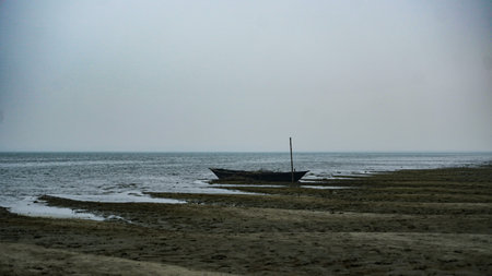 Small boat on the bank of a river. Bangladesh river scenery.の写真素材