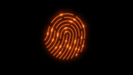 Glowing orange fingerprint pattern icon on a black background.の写真素材