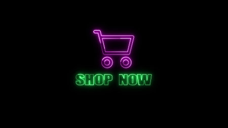 Neon sign with a shopping cart icon and text shop now on a dark background.の写真素材
