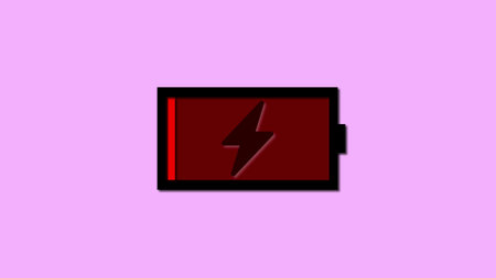 Low battery icon with lightning bolt on a purple background.の写真素材
