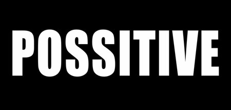 Motivational word POSITIVE in bold white letters on a black background.の写真素材