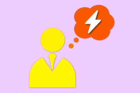 Man with a light bulb thought bubble icon on a pink background.の写真素材