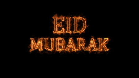Eid Mubarak text in fiery lettering on a black background.の写真素材