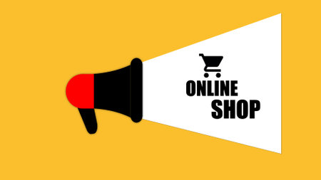 Online shopping concept with a megaphone icon and on a yellow background.の写真素材
