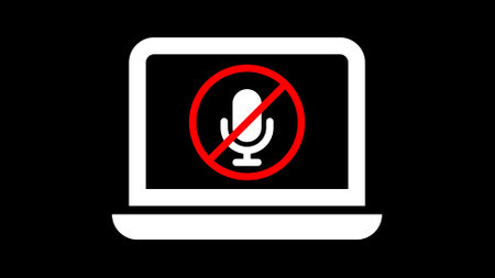 Icon of a muted microphone on a laptop screen, symbolizing microphone disabled or no audio input.の写真素材