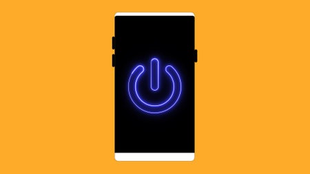 Smart phone with power button icon on a yellow background.の写真素材