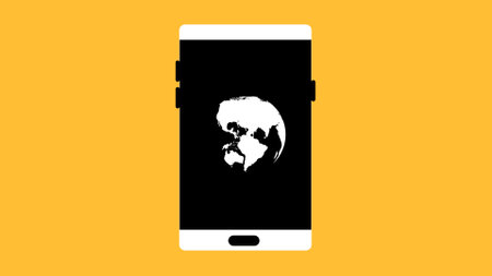 Smart phone with world is spinning on a yellow background.の写真素材