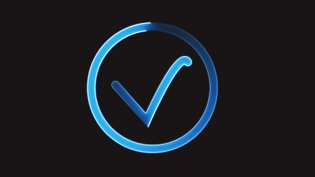 A glowing blue checkmark inside a circle on a black background.の写真素材