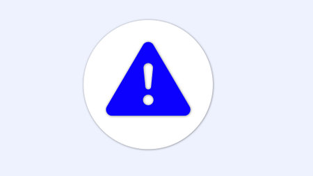 A blue triangular warning sign with an exclamation mark in the center on a white circular background.の写真素材