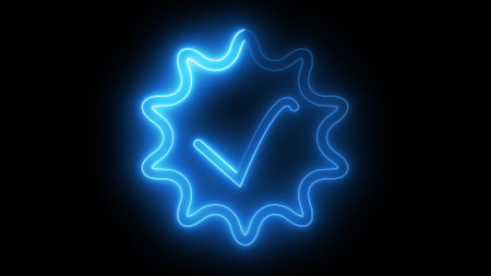A glowing blue neon checkmark inside a wavy circular border on a black background.の写真素材