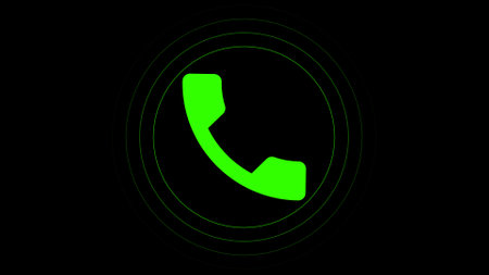 A green phone receiver icon on a black background with circular lines around it, indicating a call or communication concept.の写真素材