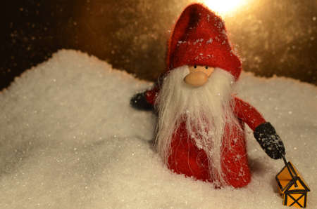 Santa Claus toy with nice soft snowflakes backgroundの写真素材