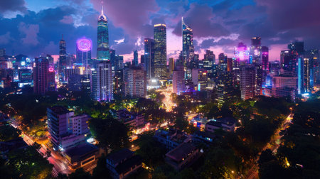 A breathtaking urban scene showcasing a vibrant city skyline illuminated by colorful lights against a dramatic twilight sky, perfect for travel and adventure themes.の素材