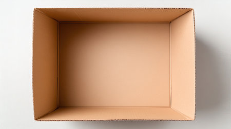 An empty cardboard box sits on a plain background, ideal for various uses such as storage, shipping, or crafting. Its neutral design enhances versatility.の素材