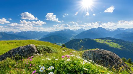 Vibrant mountain landscape features lush greenery, colorful wildflowers, and a bright sun illuminating the sky. Perfect for nature lovers and travelers.の素材