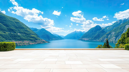 Breathtaking view of a tranquil lake surrounded by majestic mountains under a clear blue sky. Perfect for showcasing nature's beauty and relaxation.の素材