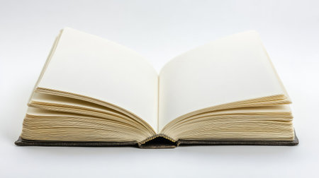 Open hardcover book with blank pages on a white background, leaving space for copy or text.の素材